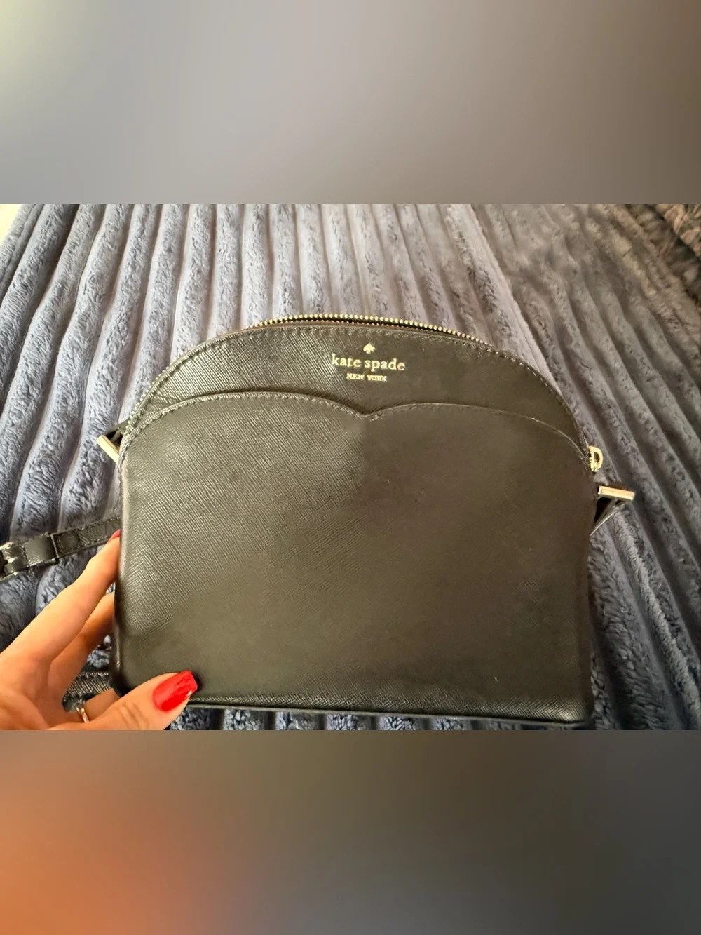 Kate Spade New York Payton Dome Crossbody in black saffiano leather.